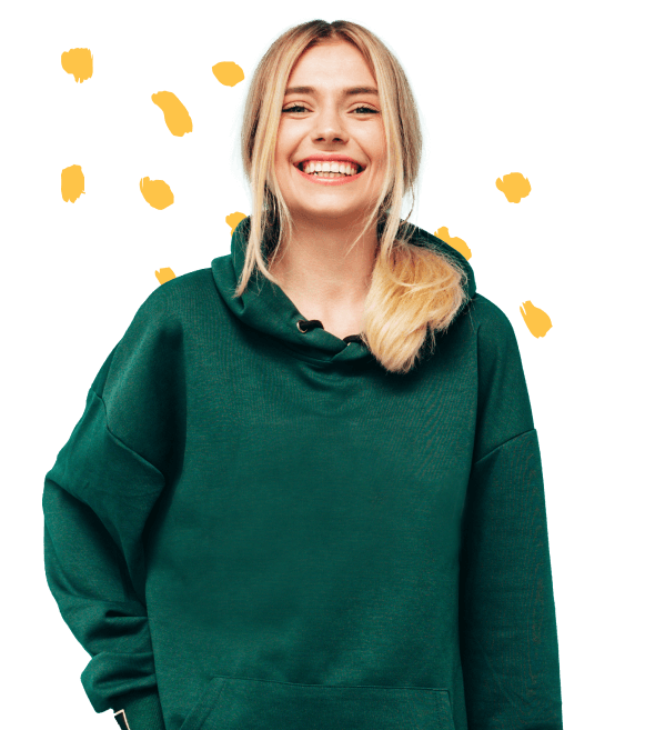 Annie, the blonde, dressed in a green hoodie with a smile on her face